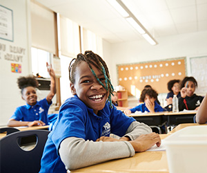 Student smiling in a classroom